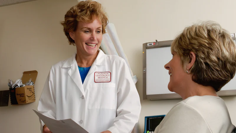 Clinician discussing care with a patient in a consulting room