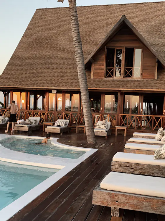 Resort poolside terrace at dusk